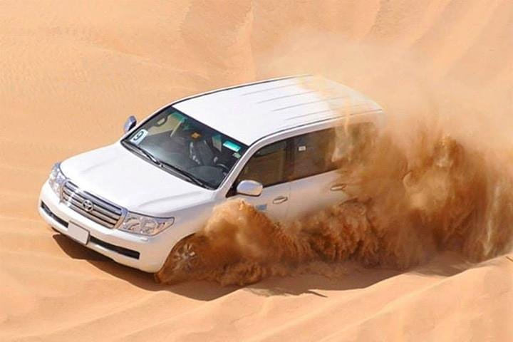 Experience the excitement of dune bashing in Dubai's stunning desert where adventure meets the serene beauty of sand dunes culminating in a memorable evening under the stars.